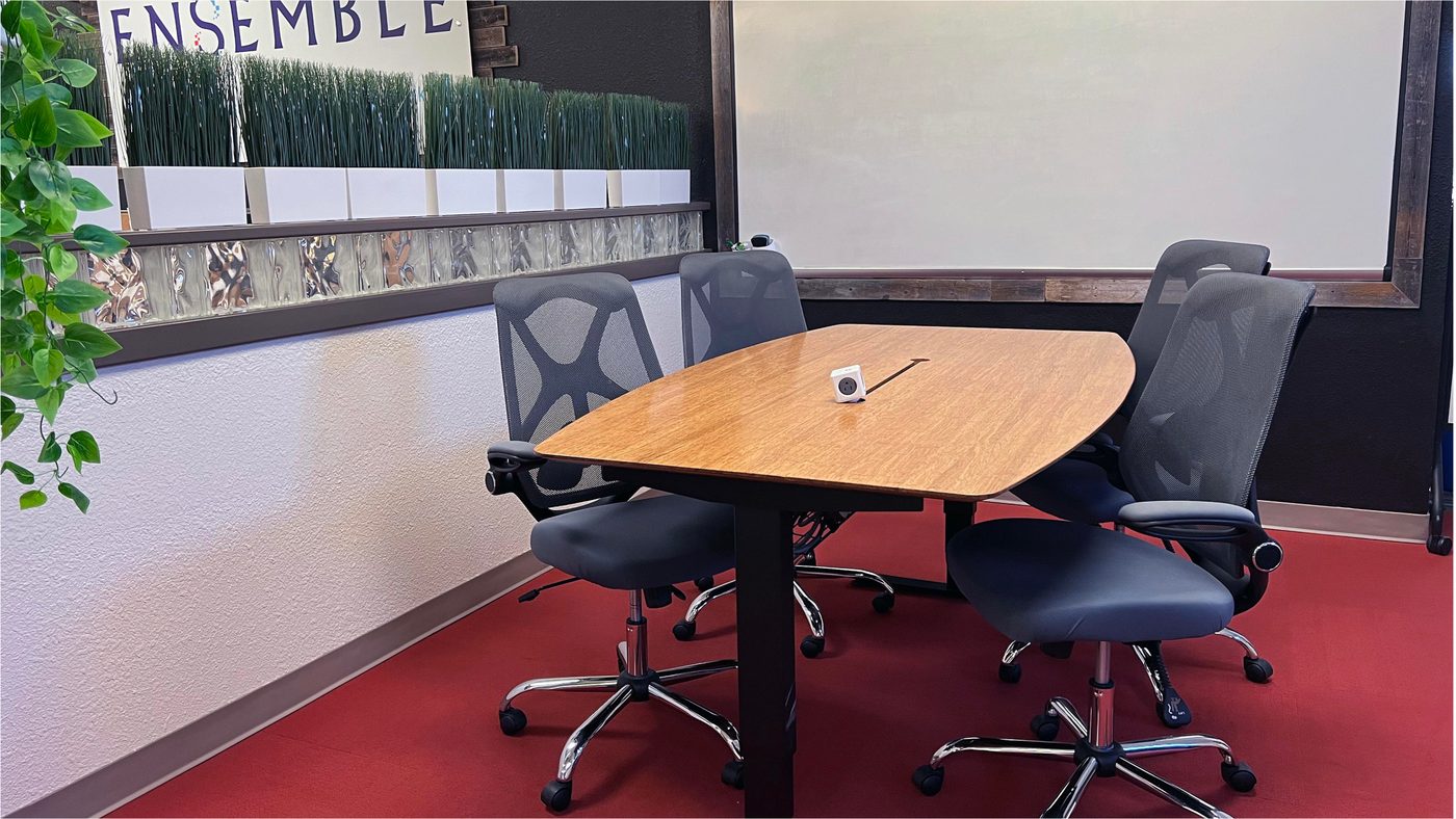 A long shared work table at Ensemble Coworking