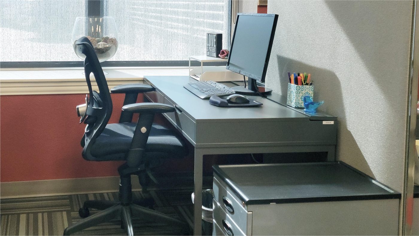 Dedicated desks with privacy panels at Ensemble Coworking Fort Worth