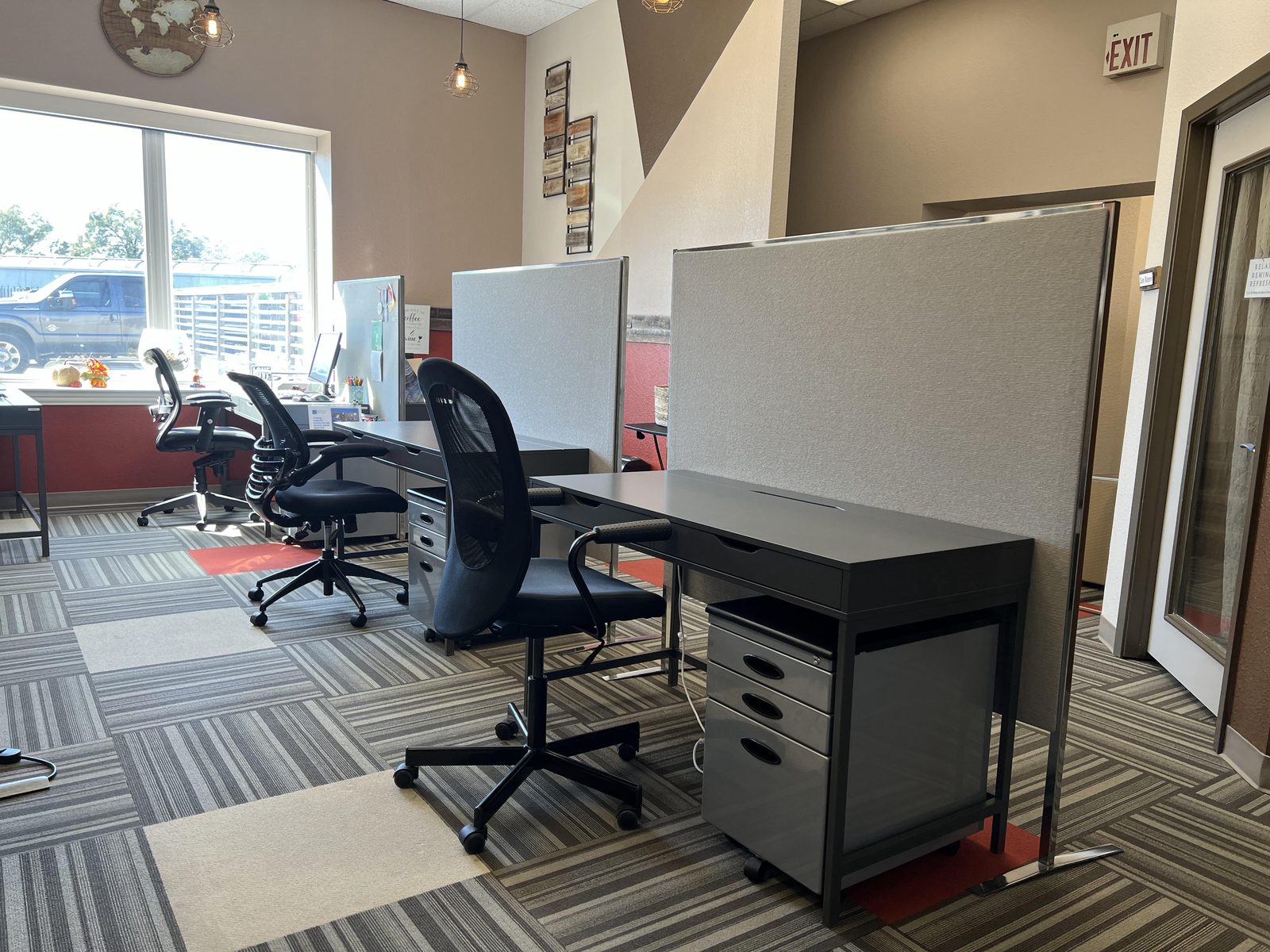 Dedicated desk with locking file cabinet at Ensemble Coworking