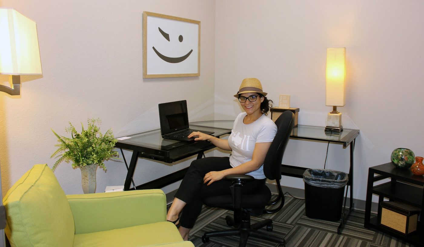 Members working in the lounge area at Ensemble Coworking in Fort Worth