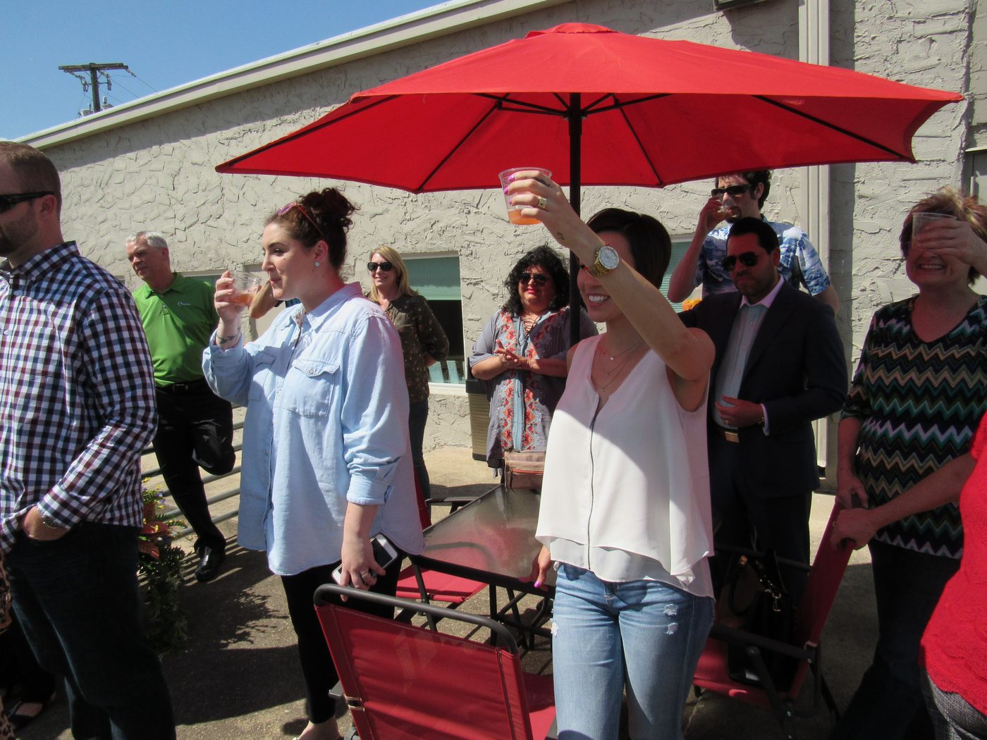 Members gathered on the patio at Ensemble Coworking